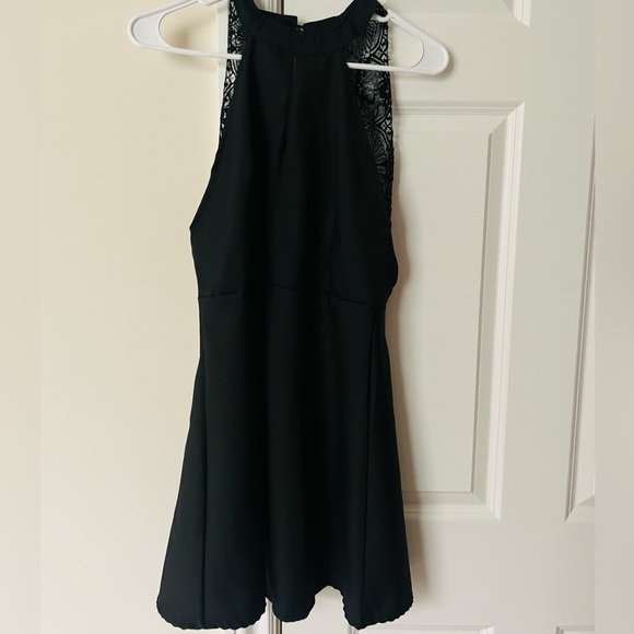 Dresses & Skirts - Black dress with key hole front and fun lace back size medium